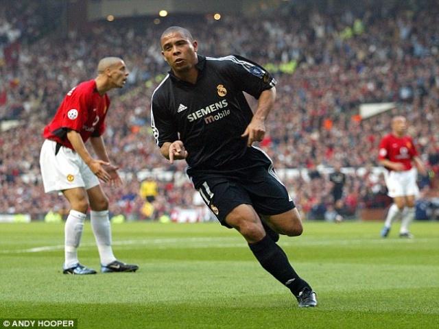 Ronaldo wheels away from Rio Ferdinand following his first goal against United.     